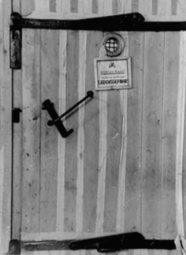A door to a gas chamber in Auschwitz. The note reads: Harmful gas! Entering endangers your life. Image courtesy of USHMM Photo Archives via http://history1900s.about.com/library/holocaust 